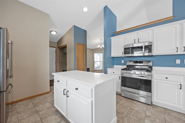 kitchen featuring a center island, stainless steel appliances, lofted ceiling, light countertops, and light tile patterned flooring