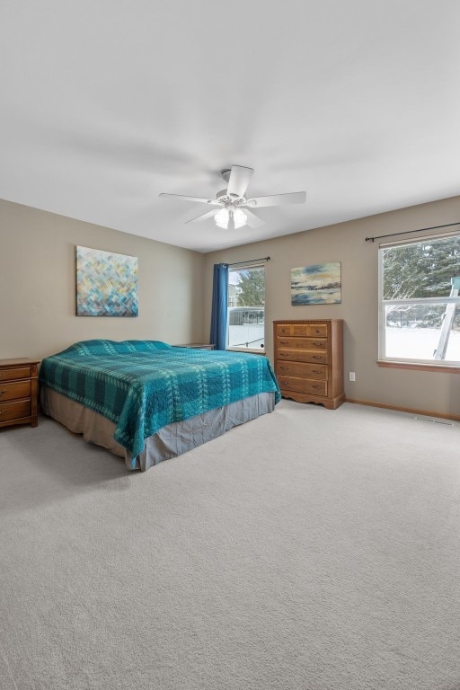 carpeted bedroom with a ceiling fan