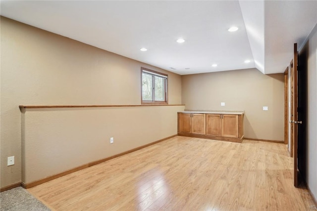 interior space with light wood-style floors, recessed lighting, and baseboards