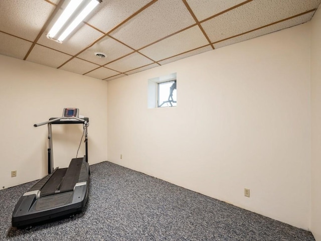 workout room with a drop ceiling, carpet flooring, and visible vents