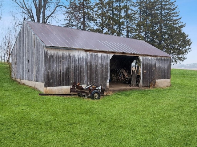 view of pole building with a lawn