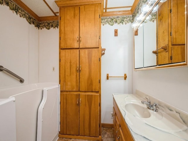 full bath with a washtub and vanity