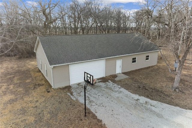 exterior space featuring roof with shingles