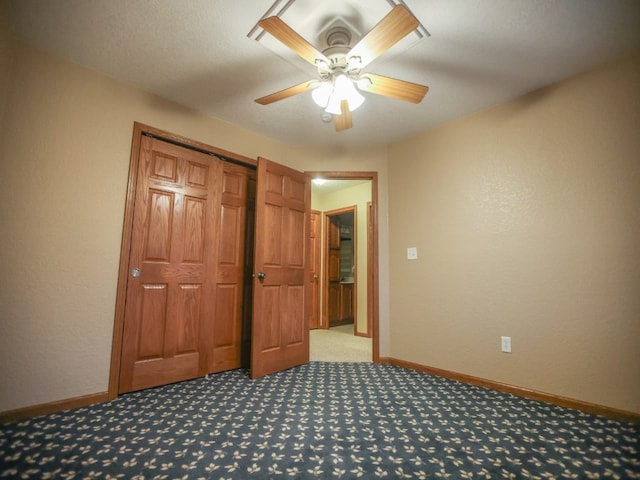 unfurnished bedroom with a ceiling fan, a closet, light carpet, and baseboards