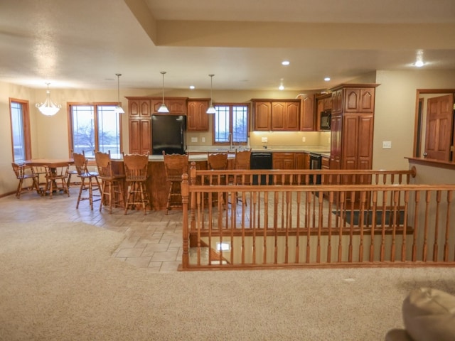 dining space with recessed lighting, stone finish floor, and light colored carpet