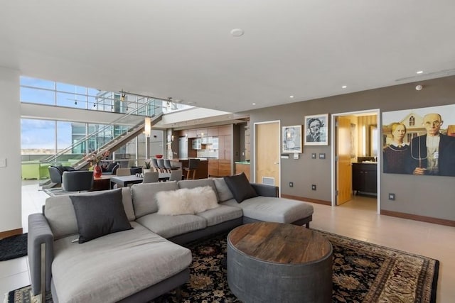 living room featuring baseboards and recessed lighting