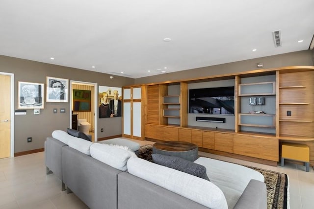 living area featuring recessed lighting, visible vents, baseboards, and light tile patterned floors