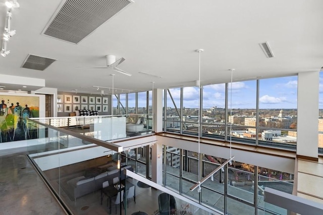 interior space with visible vents and a city view