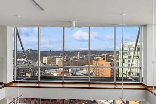 interior space with visible vents and a city view