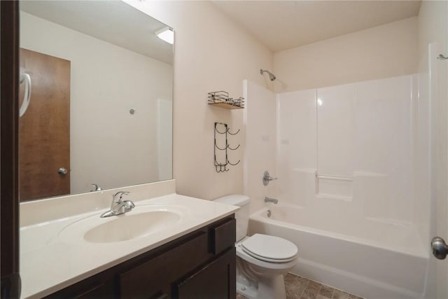 bathroom with toilet, vanity, and shower / bathing tub combination