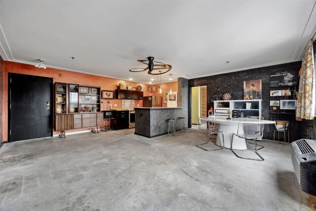 400 1st St SE Unit 203, Cedar Rapids, IA 52401 - living room featuring concrete floors, a ceiling fan, and ornamental molding