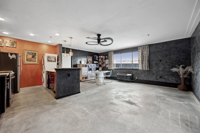 400 1st St SE Unit 203, Cedar Rapids, IA 52401 - kitchen with a ceiling fan, concrete flooring, washer / clothes dryer, recessed lighting, and freestanding refrigerator