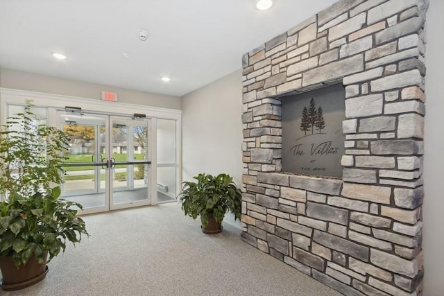 interior space featuring carpet floors, recessed lighting, and french doors