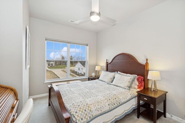 bedroom featuring carpet floors, baseboards, visible vents, and a ceiling fan