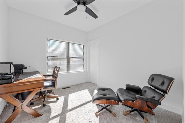 carpeted office featuring ceiling fan, visible vents, and baseboards