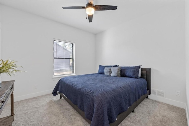 bedroom with carpet floors, baseboards, and a ceiling fan