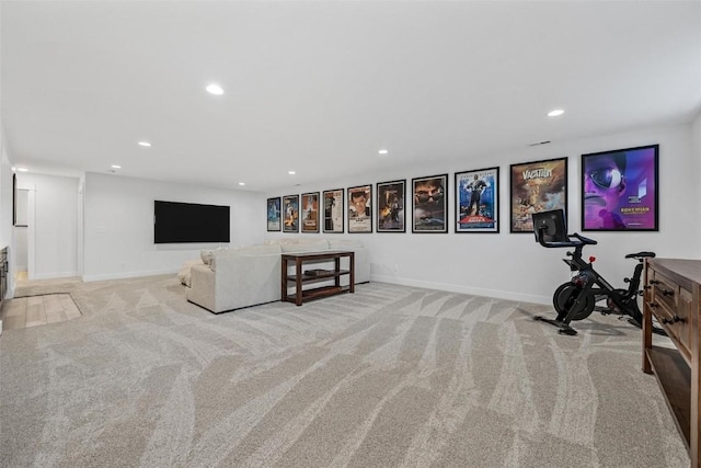 living room featuring carpet, baseboards, and recessed lighting