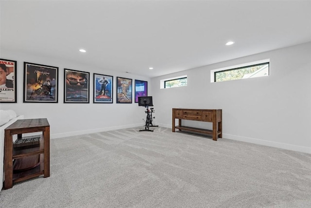 basement featuring baseboards, carpet flooring, and recessed lighting