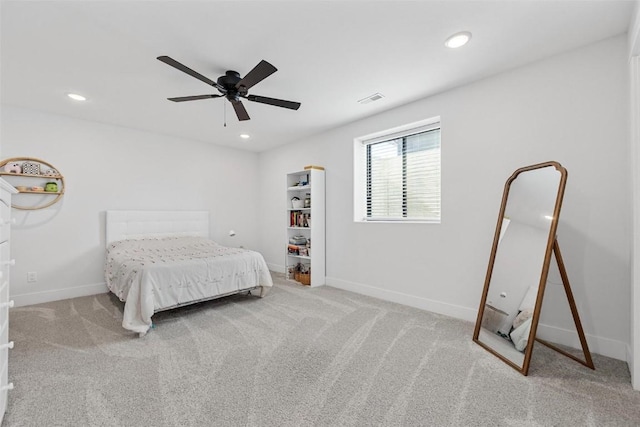 carpeted bedroom with ceiling fan, visible vents, baseboards, and recessed lighting