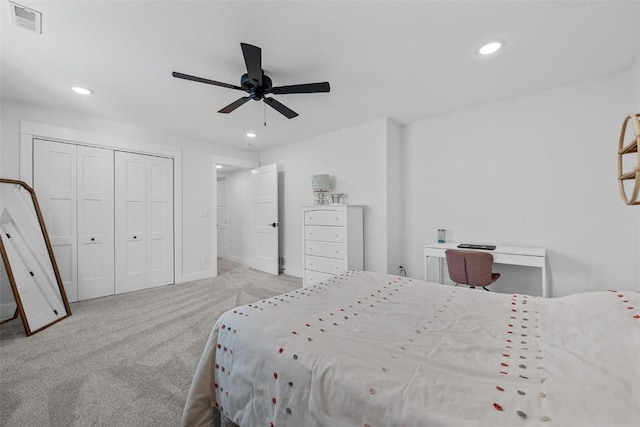 carpeted bedroom featuring ceiling fan, visible vents, and recessed lighting