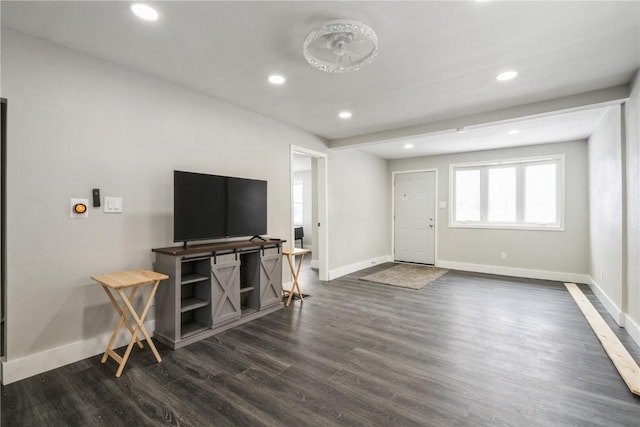 living area featuring dark wood-style floors, recessed lighting, and baseboards