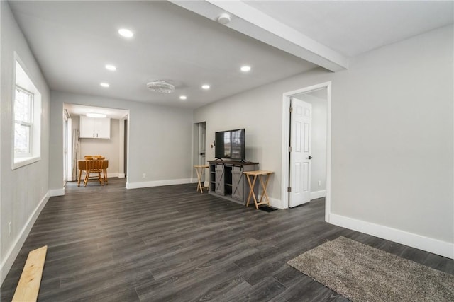 interior space featuring baseboards, dark wood finished floors, beamed ceiling, and recessed lighting