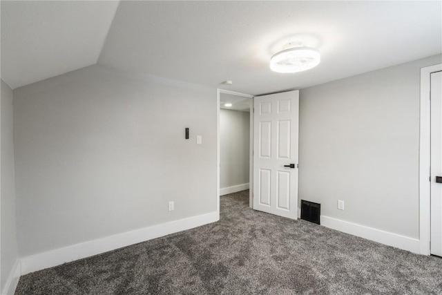 unfurnished bedroom featuring carpet, visible vents, and baseboards