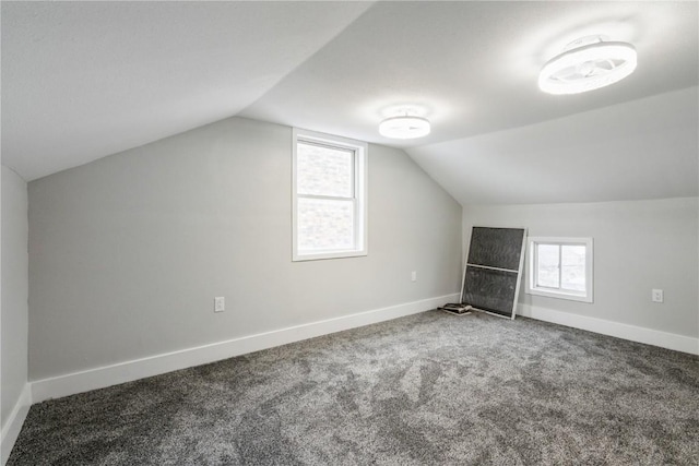 bonus room with carpet flooring, vaulted ceiling, and baseboards