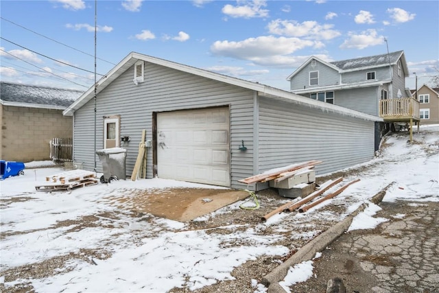 exterior space with an outbuilding and a detached garage