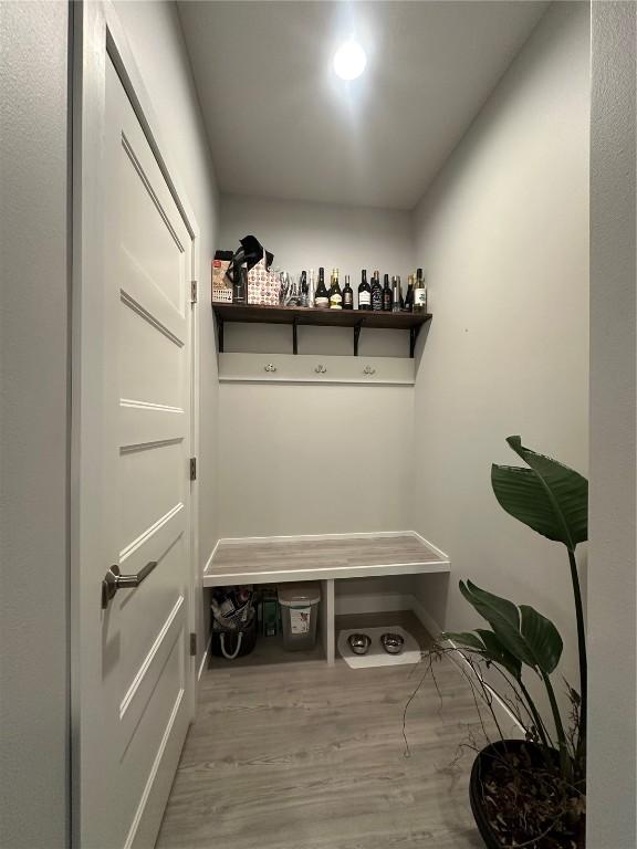 mudroom with wood finished floors