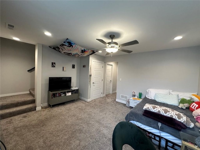 carpeted bedroom with a ceiling fan, recessed lighting, visible vents, and baseboards