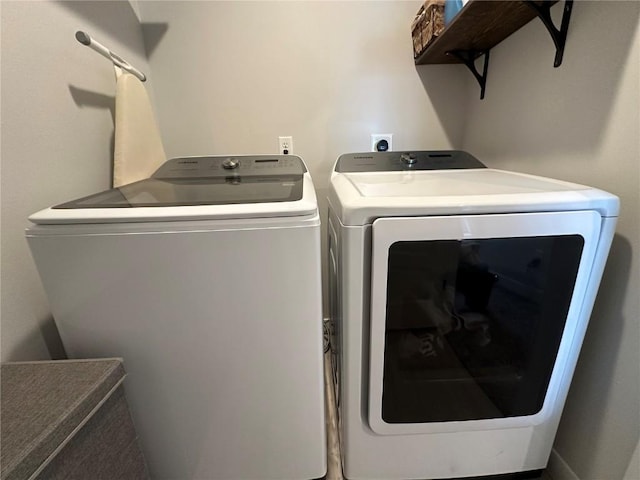 clothes washing area with laundry area and independent washer and dryer