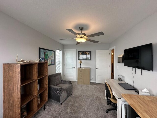 office area featuring carpet floors and a ceiling fan