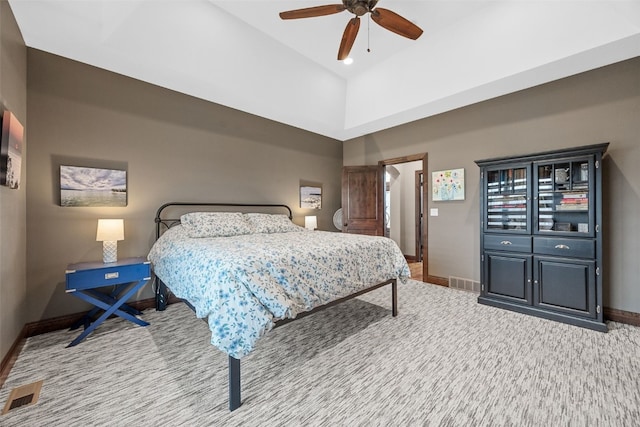 carpeted bedroom featuring baseboards, visible vents, and a ceiling fan