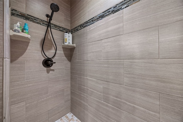 full bathroom with tiled shower