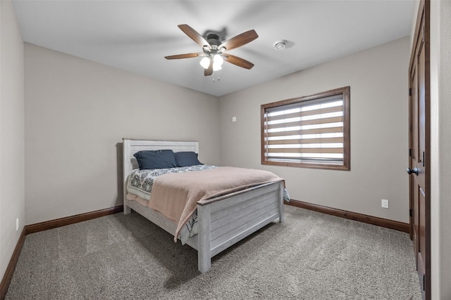 carpeted bedroom featuring a ceiling fan and baseboards