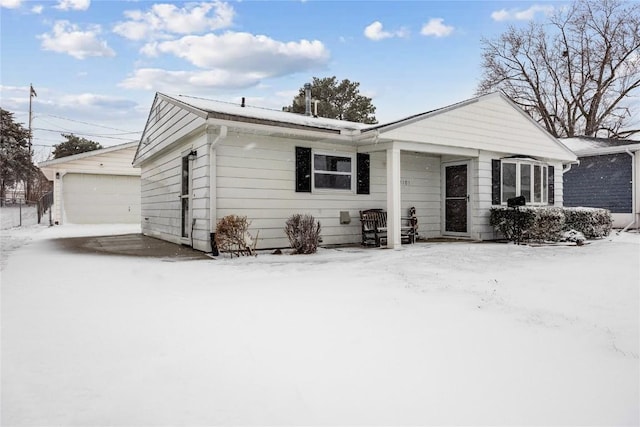 ranch-style home with an outdoor structure and a detached garage