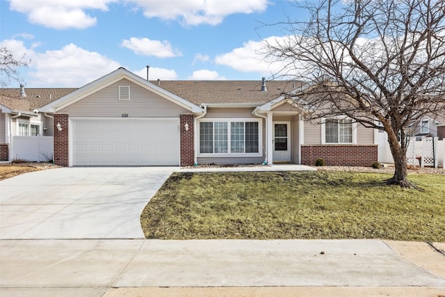 ranch-style home with brick siding, concrete driveway, an attached garage, a front yard, and fence