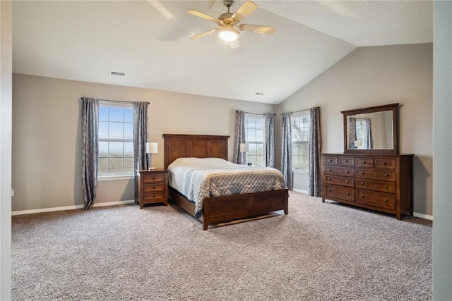 bedroom with carpet floors, baseboards, visible vents, and vaulted ceiling