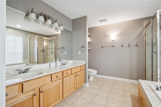 bathroom featuring a sink, double vanity, tile patterned flooring, and a shower stall