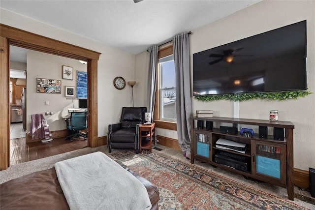 living room featuring baseboards and wood finished floors