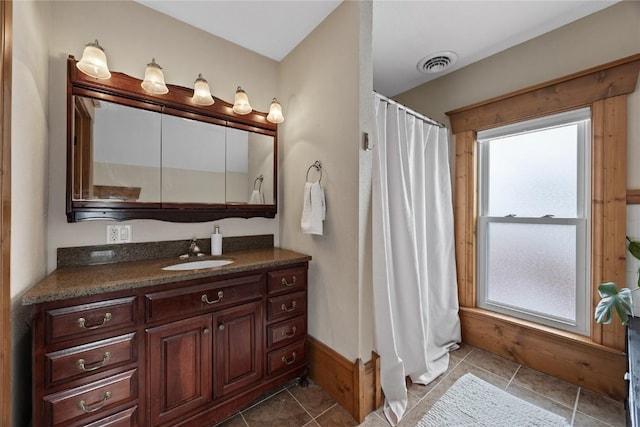 full bathroom with curtained shower, tile patterned flooring, vanity, and visible vents