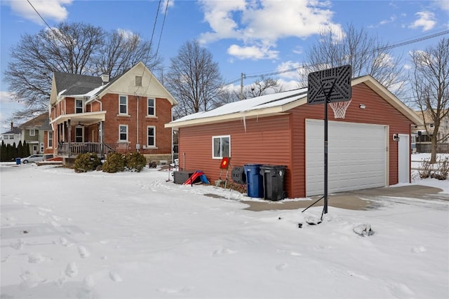 exterior space featuring a garage, covered porch, a chimney, and an outbuilding