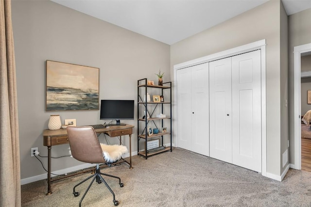 home office featuring carpet flooring and baseboards