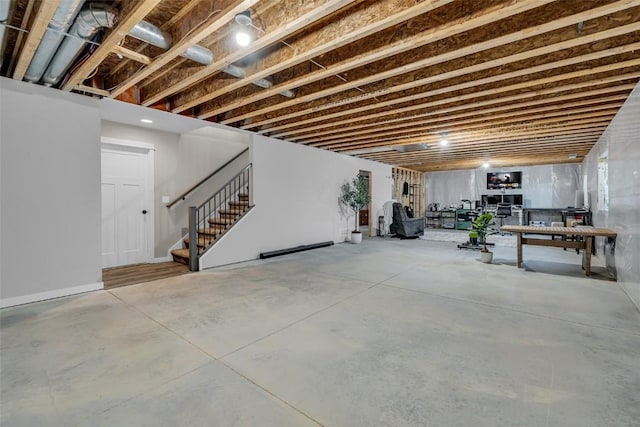 unfinished basement featuring stairway