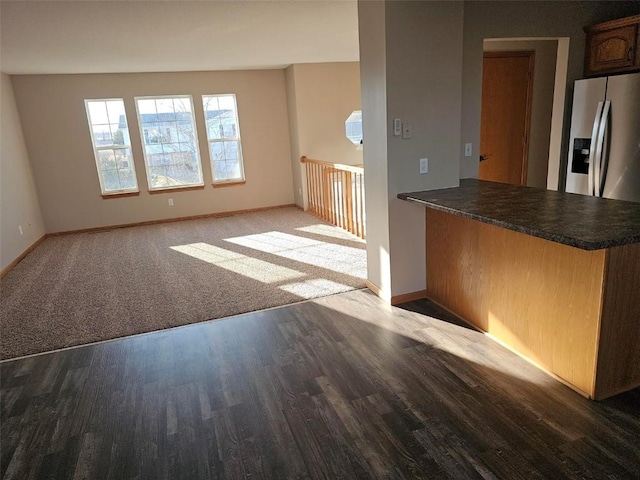 203 Maxwell Dr, Shellsburg, IA 52332 - unfurnished living room with wood finished floors and baseboards