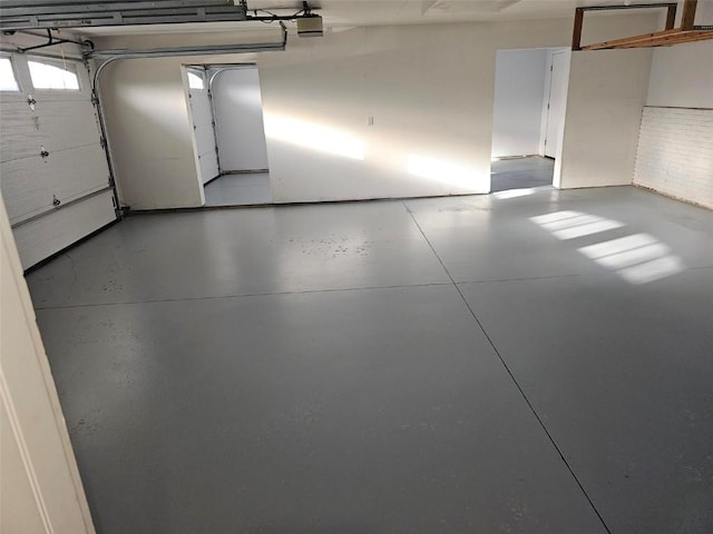 203 Maxwell Dr, Shellsburg, IA 52332 - garage featuring a garage door opener