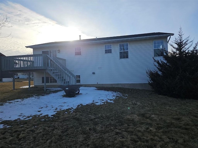 back of property with stairway and a deck