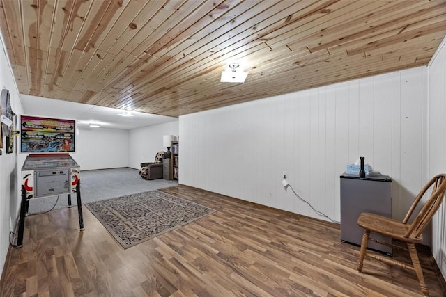 interior space with wooden ceiling and wood finished floors