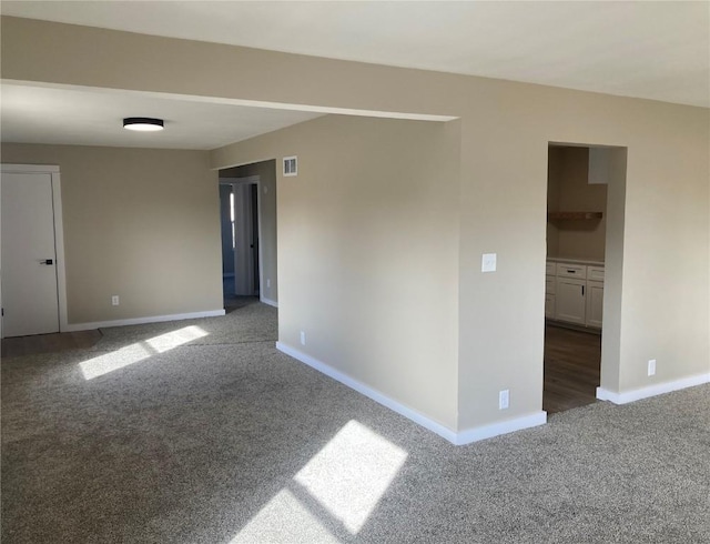 208 G Ave, Vinton, IA 52349 - carpeted spare room featuring baseboards